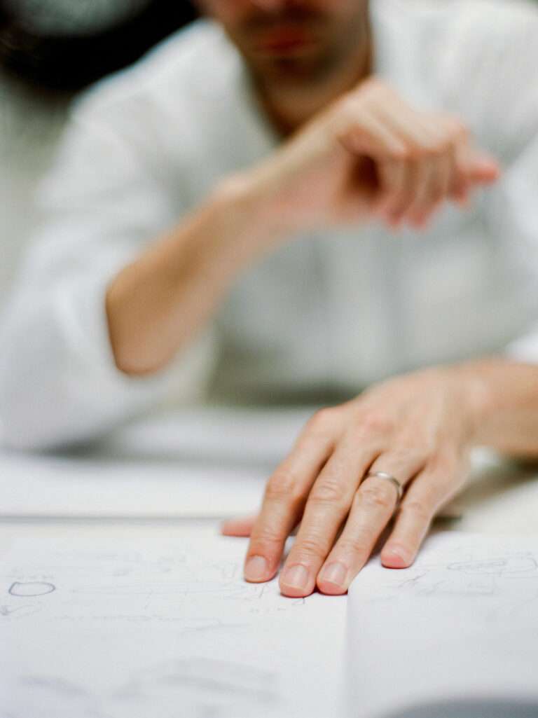 Close-up of Serge Rusak drawing initial sketches for bespoke furniture