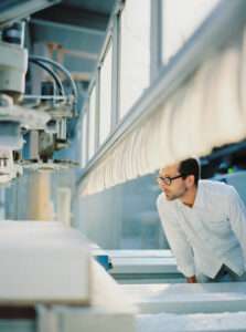 Serge Rusak overseeing the final stages of table construction