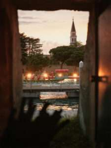 Illuminated boats performing on the canal during the Naumachia Ball in Venice