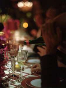 Fine tableware and floral arrangement details at Dior event in Venice