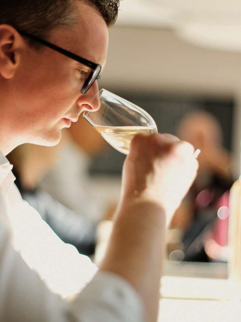 Portrait of Krug Champagne tasting expert in a natural, warm setting