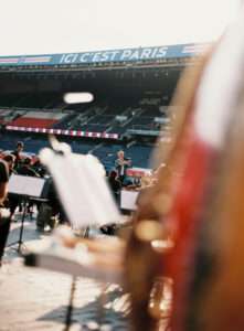 Orchestra performing during Ligue 1 closing ceremony led by Thomas Roussel
