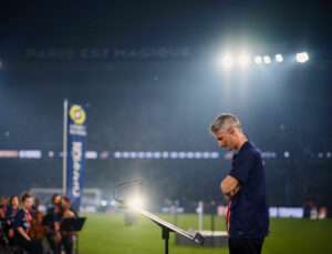 Thomas Roussel conducting classical orchestra at PSG stadium for Ligue 1 closing ceremony
